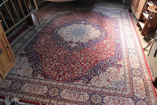 Persian design blue, red and ivory medallion carpet